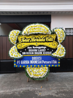 Papan Bunga Duka di Tanah Sereal