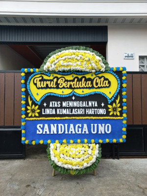 Papan Bunga Duka di Tanah Sereal
